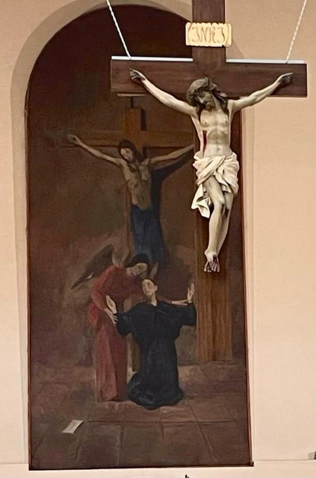 Slika iznad oltara i groba svete Gemme u Lucci: sveta Gemma kleči i predaje molitve anđelu čuvaru, a on ih nosi Kristu na križu. Ispod Gemme na podu je bijelo pismo.